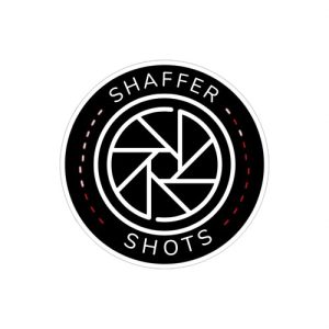Logo for Shaffer Shots photography business. Stylized text reading "Shaffer Shots" is around an illustration of a camera aperture.